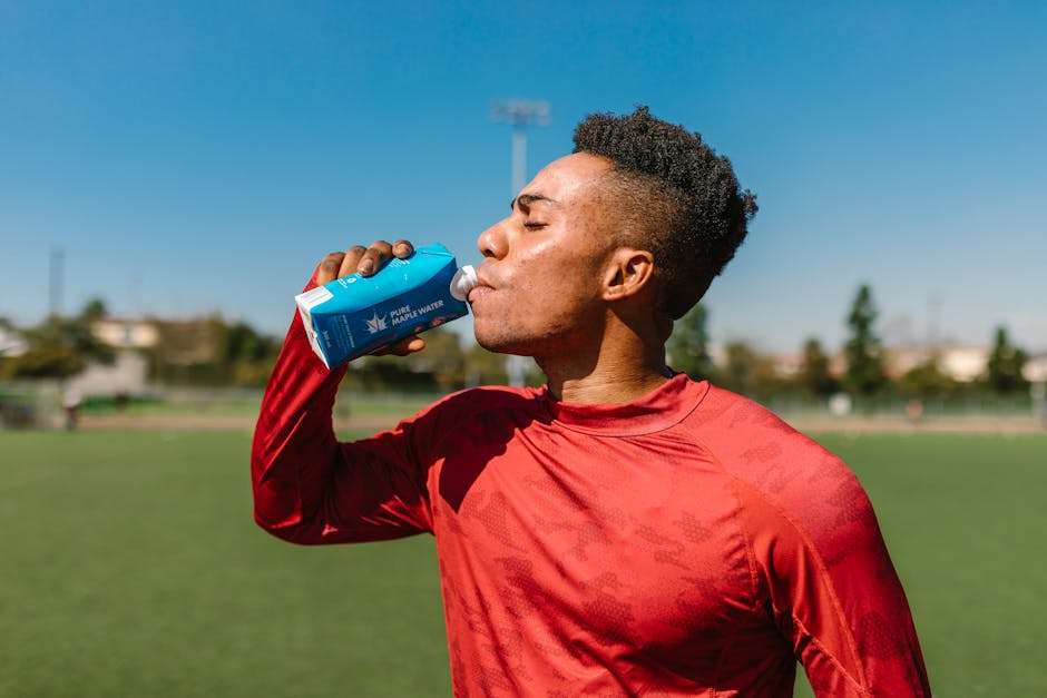 female athlete drinking water hydration sports