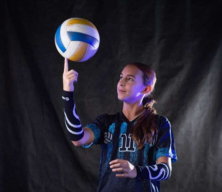 teen volleyball player reflecting after game