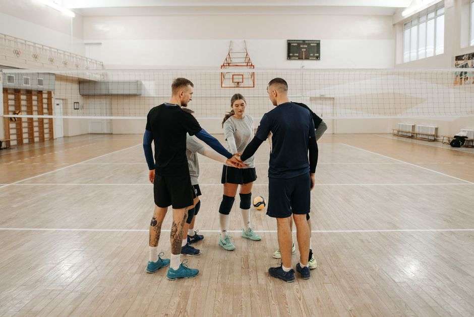 young volleyball players team huddle trust
